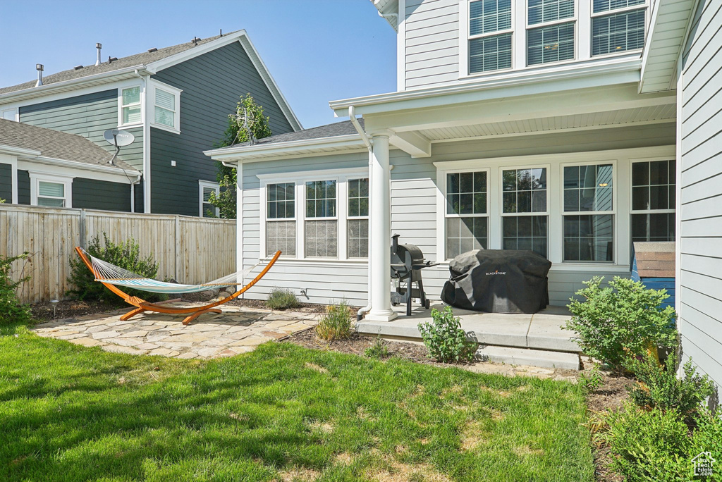 Back of property featuring a patio area