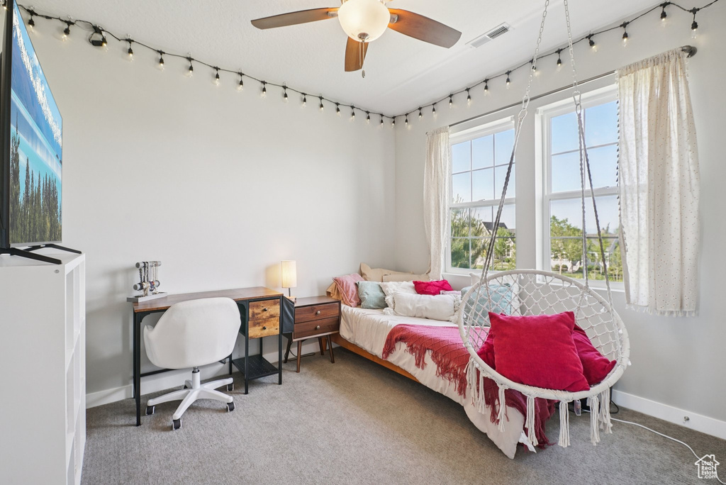 Carpeted bedroom with baseboards and a water view