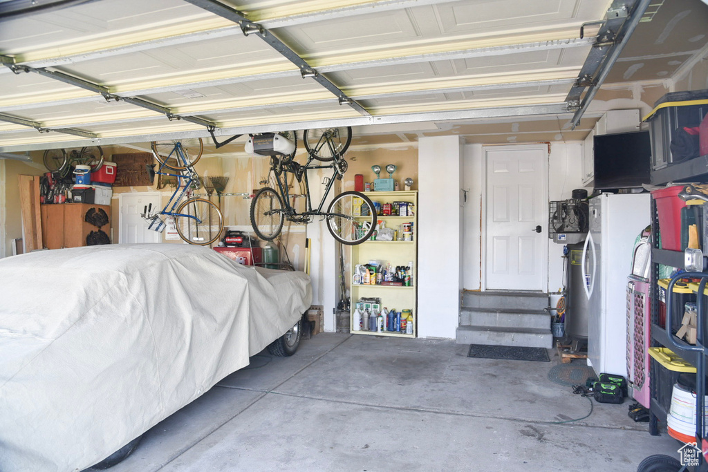 Garage featuring a garage door opener