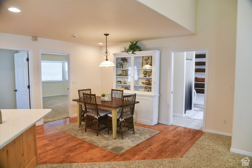 Dining room with baseboards, recessed lighting, and light wood finished floors