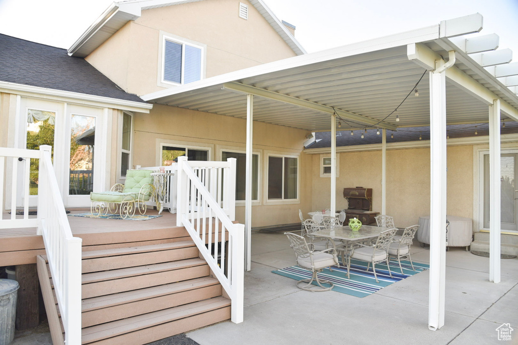 View of patio featuring outdoor dining space and area for grilling