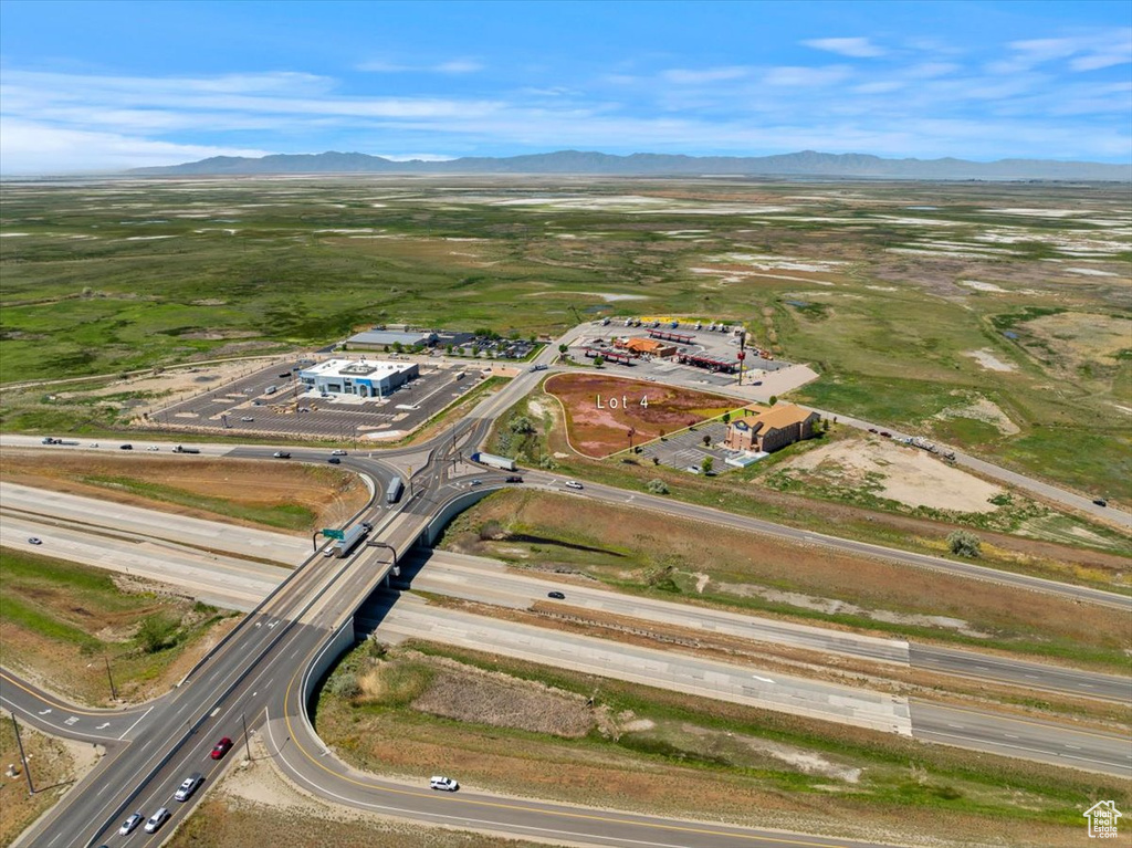Aerial view of property and surrounding area featuring mountains