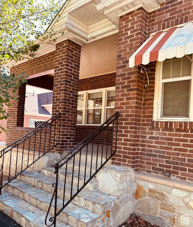 Property entrance with brick siding