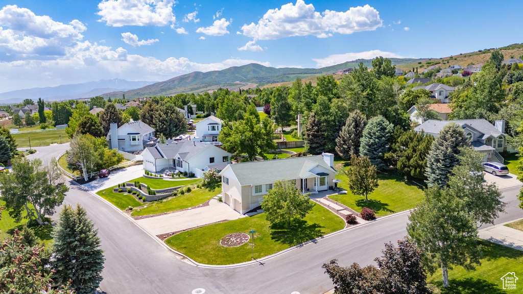 Aerial view of residential area featuring mountains