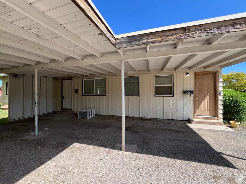 Doorway to property with board and batten siding