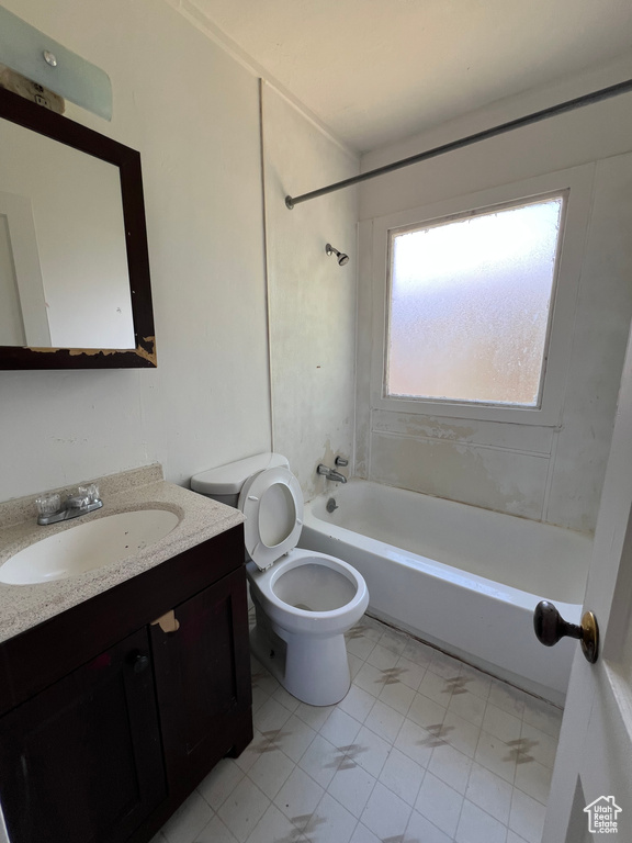 Full bathroom featuring vanity, toilet, and shower / bathtub combination