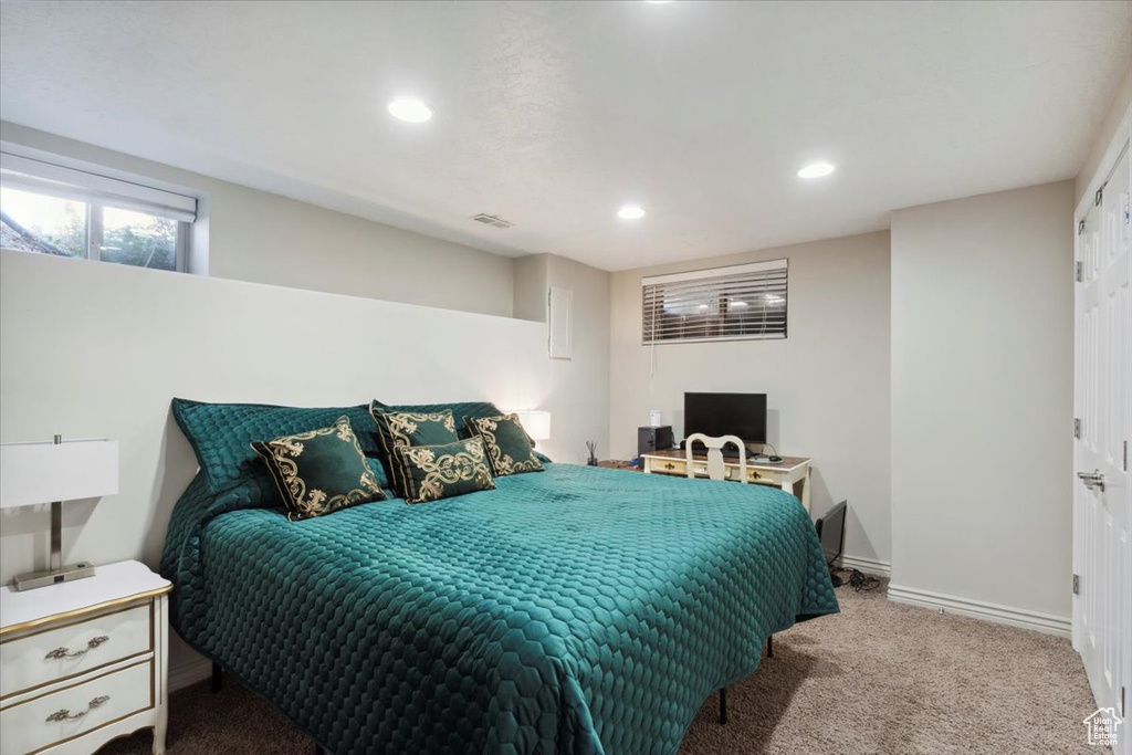 Carpeted bedroom featuring recessed lighting and baseboards