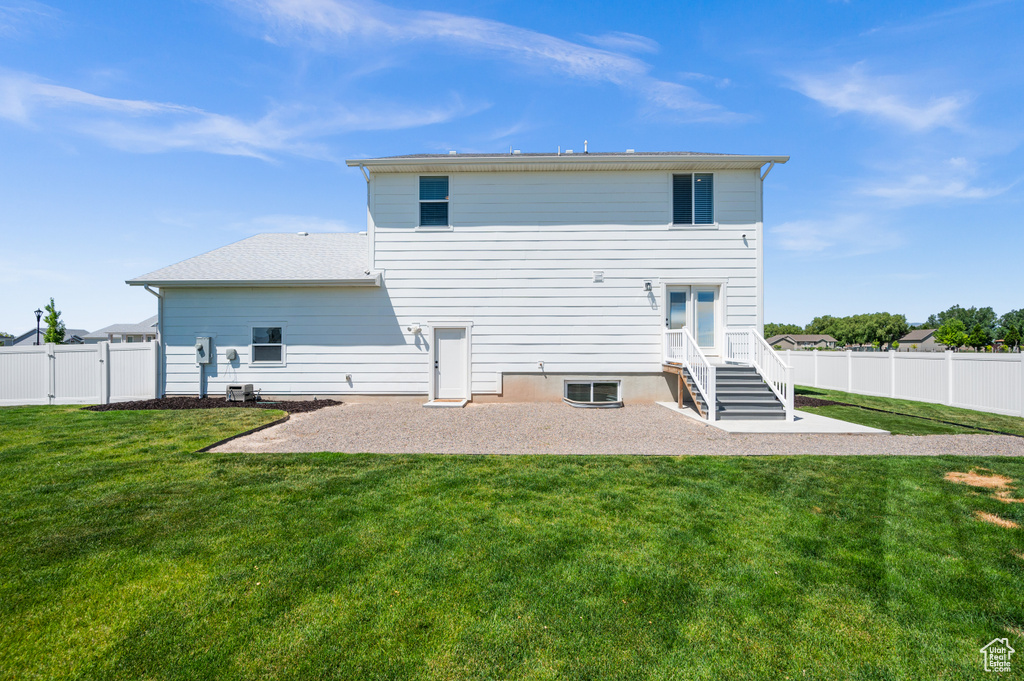 Back of property with a patio