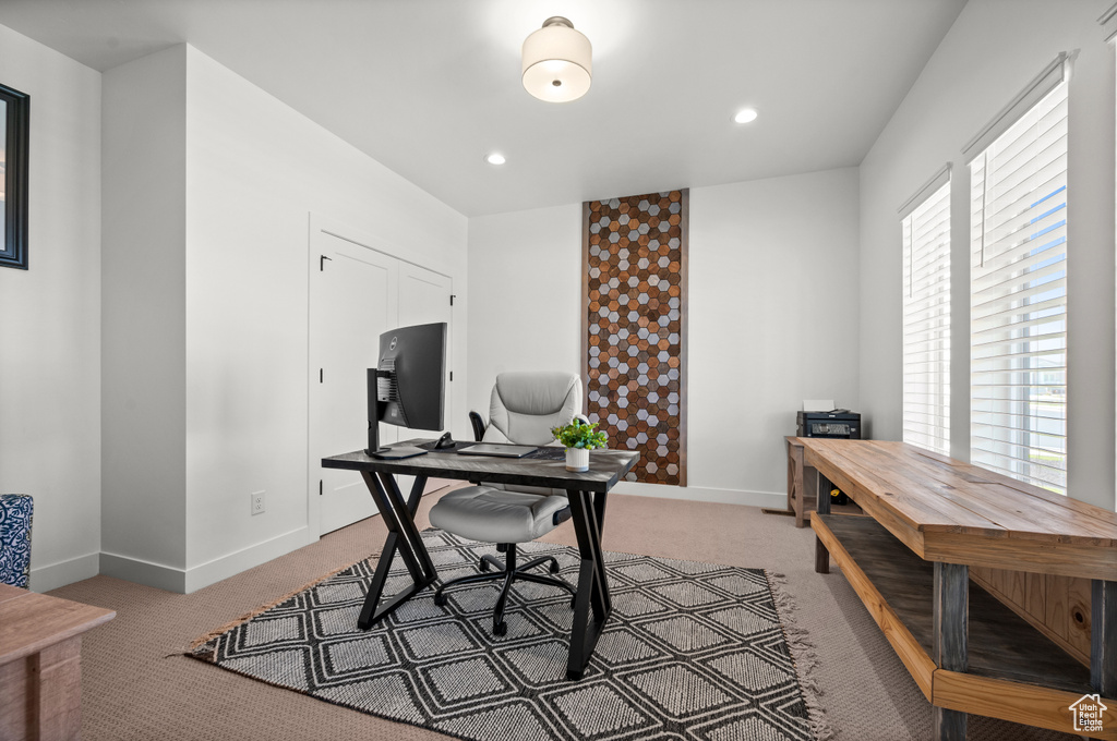 Office area featuring light colored carpet, baseboards, and recessed lighting