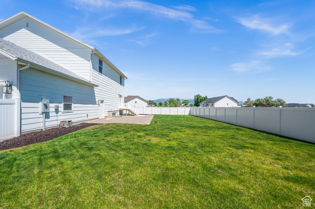 View of yard with a patio