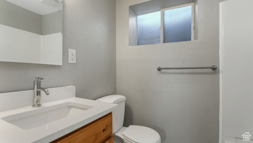 Bathroom featuring toilet and vanity