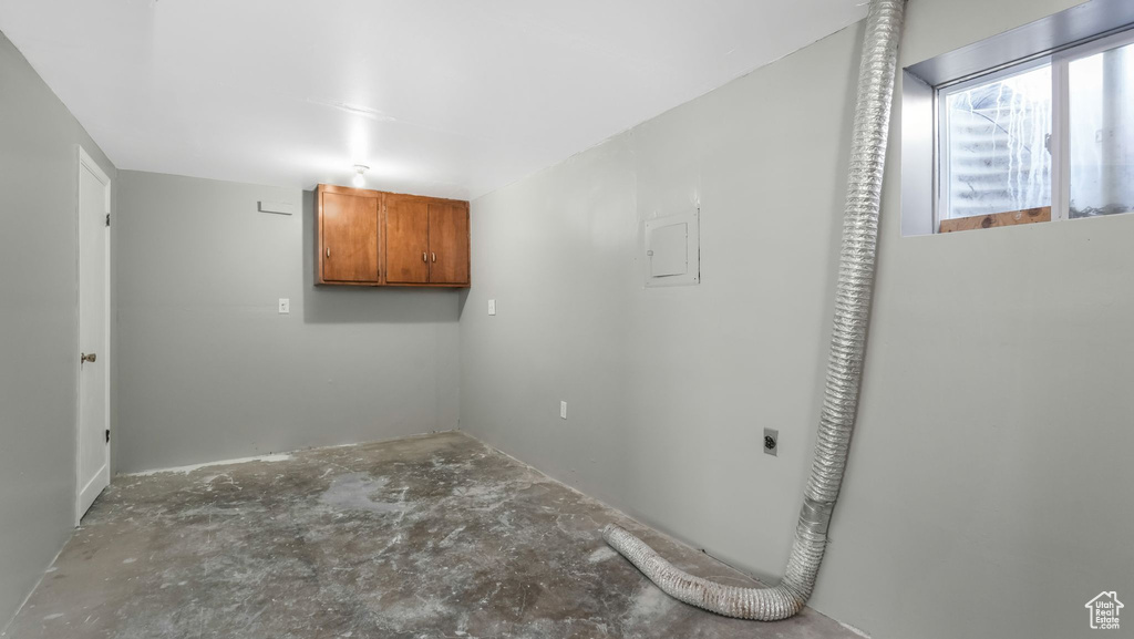 Empty room with unfinished concrete floors