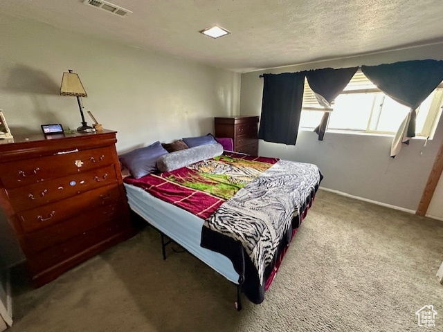 Bedroom with carpet and baseboards