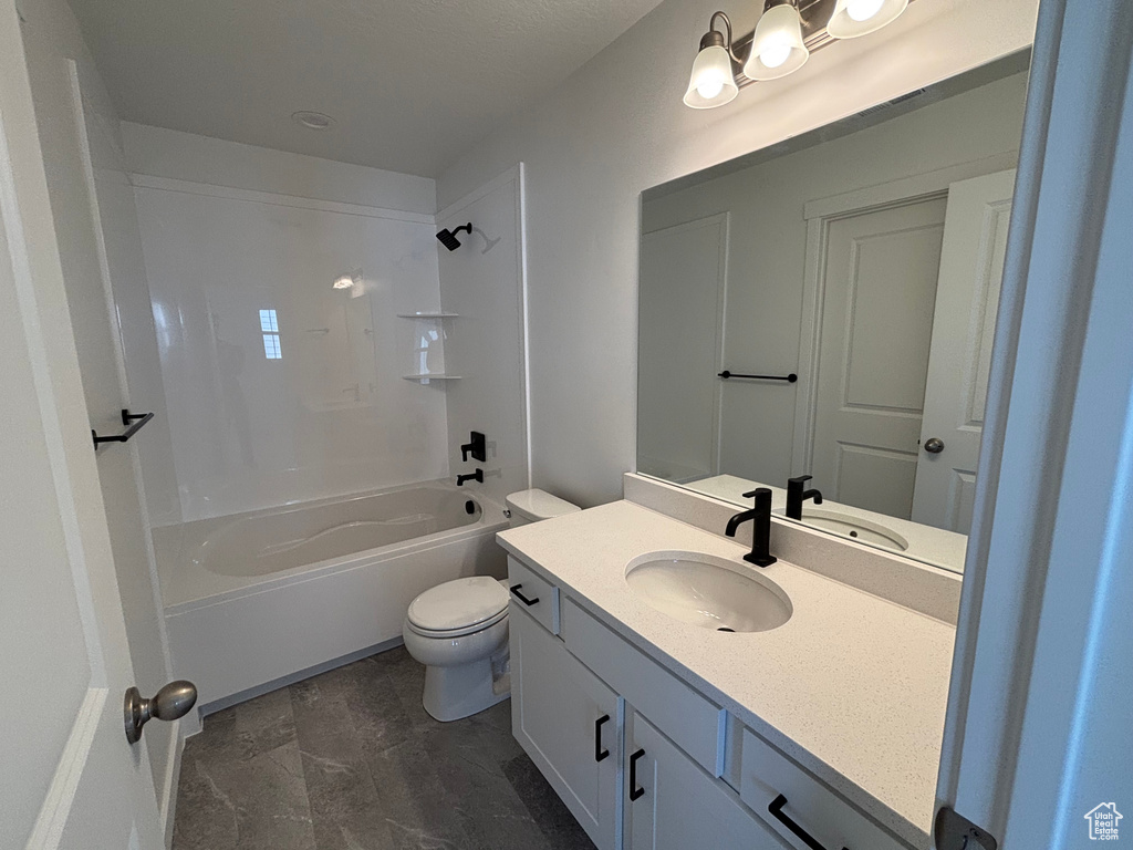 Full bathroom featuring vanity, toilet, and shower / bathtub combination
