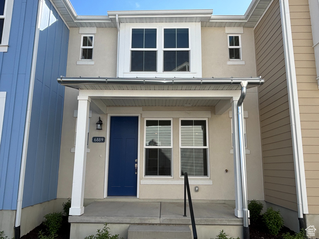 Entrance to property with covered porch