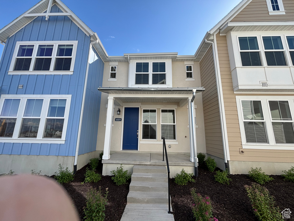 View of front of house featuring a porch and board and batten siding
