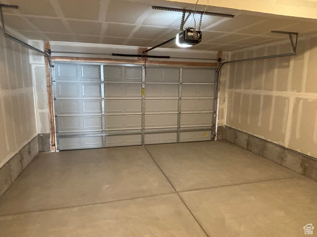 Garage featuring a garage door opener