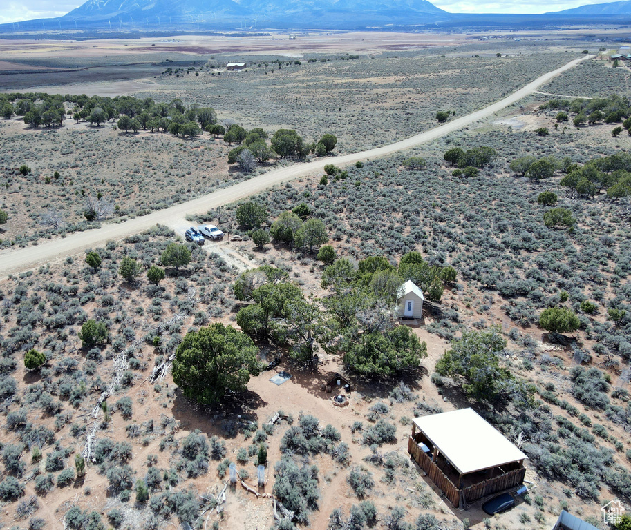 Overview of rural landscape featuring a mountainous background and a desert landscape