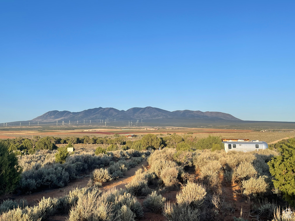 View of mountain backdrop with rural landscape