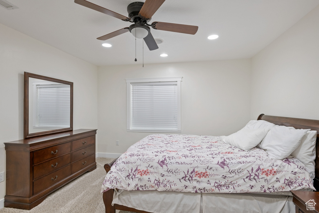 Bedroom featuring light carpet, baseboards, recessed lighting, and ceiling fan