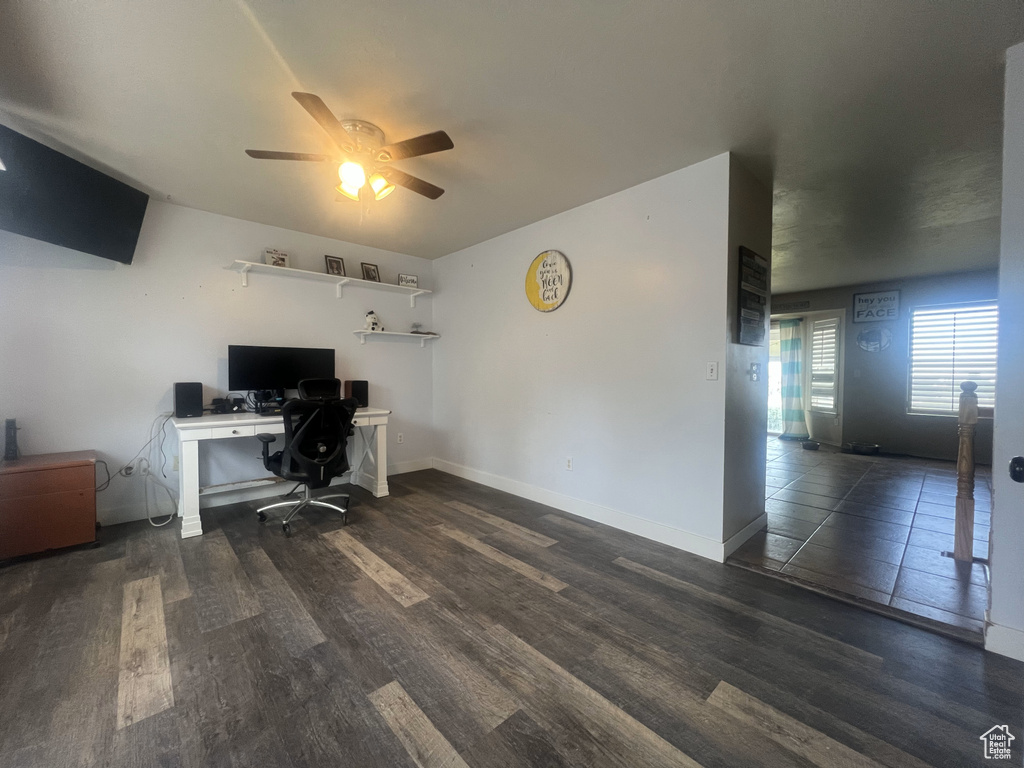 Office space featuring ceiling fan, wood finished floors, and baseboards