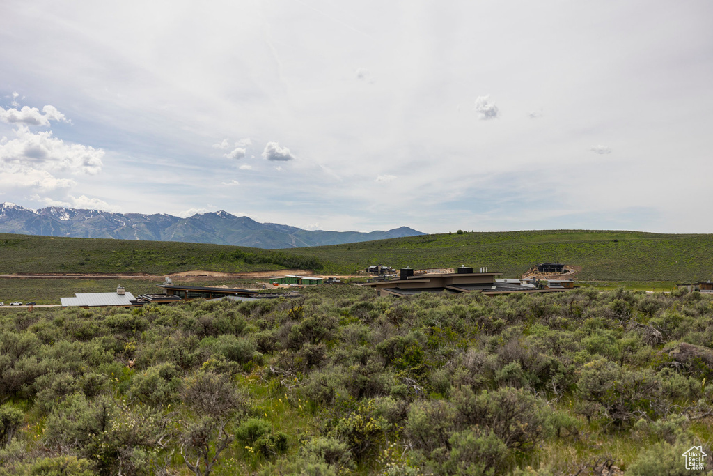 View of mountain backdrop featuring rural landscape