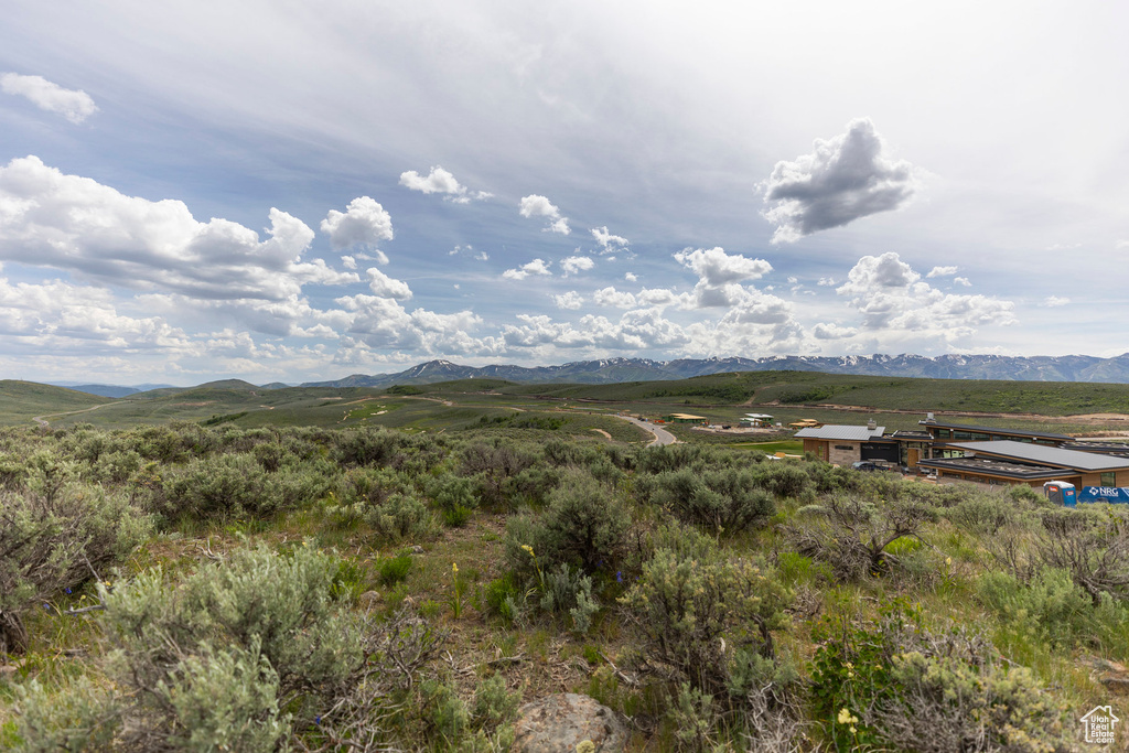 View of mountain backdrop with rural landscape