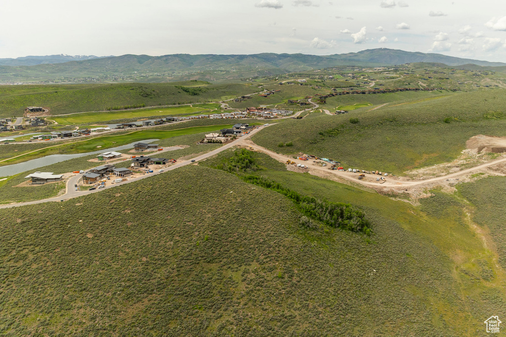 Aerial view of property's location with mountains and rural landscape