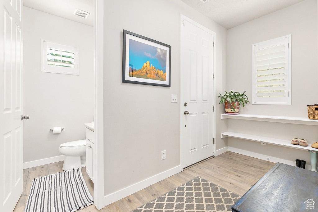 Entryway featuring light wood-type flooring and baseboards