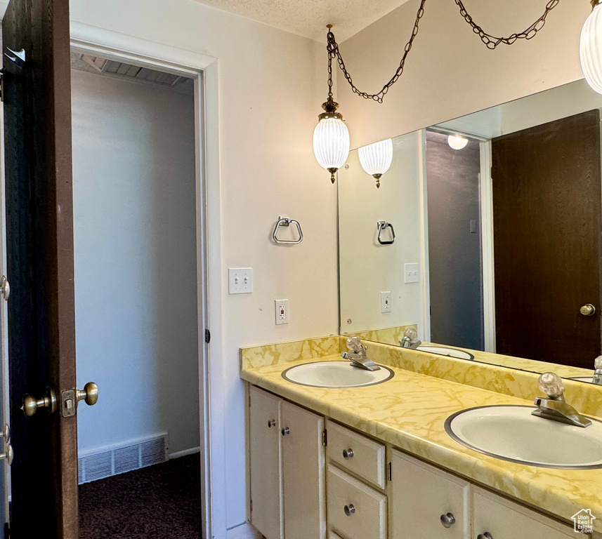 Full bath featuring double vanity