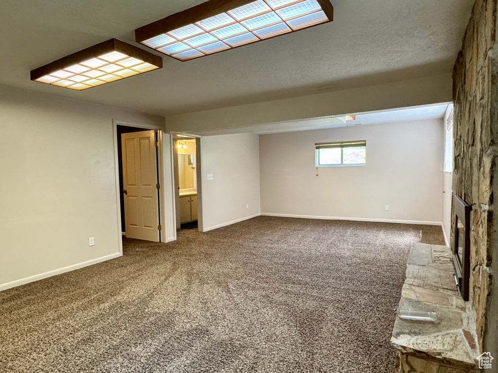 Carpeted empty room with baseboards