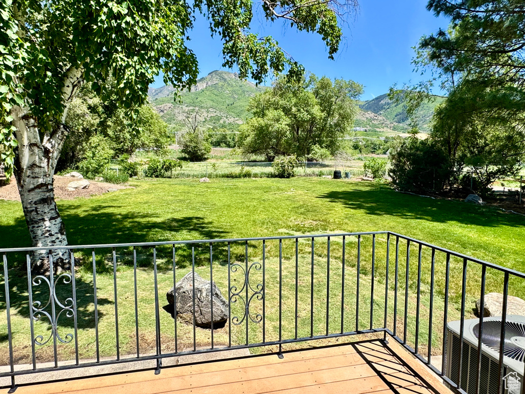 Balcony with a mountain view and central air condition unit