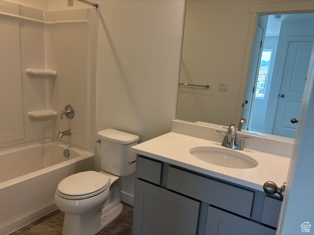 Full bath with vanity, shower / tub combination, and toilet