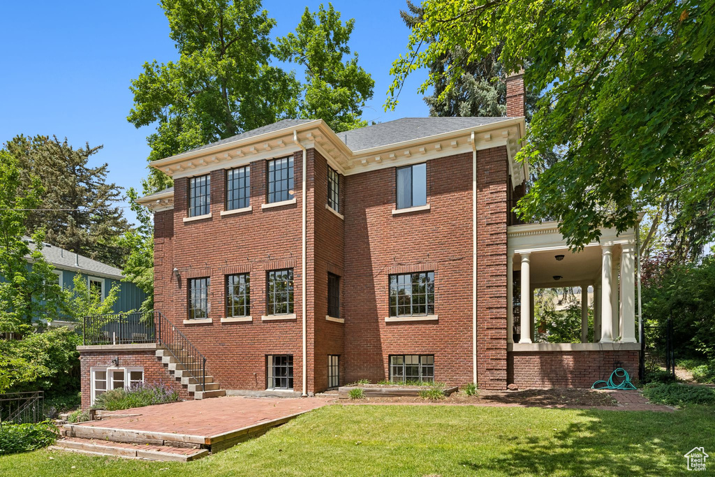 View of property with stairs