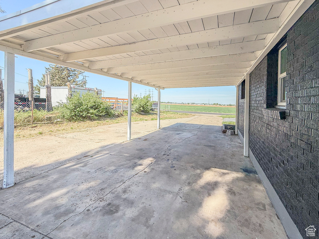 View of patio / terrace featuring an attached carport