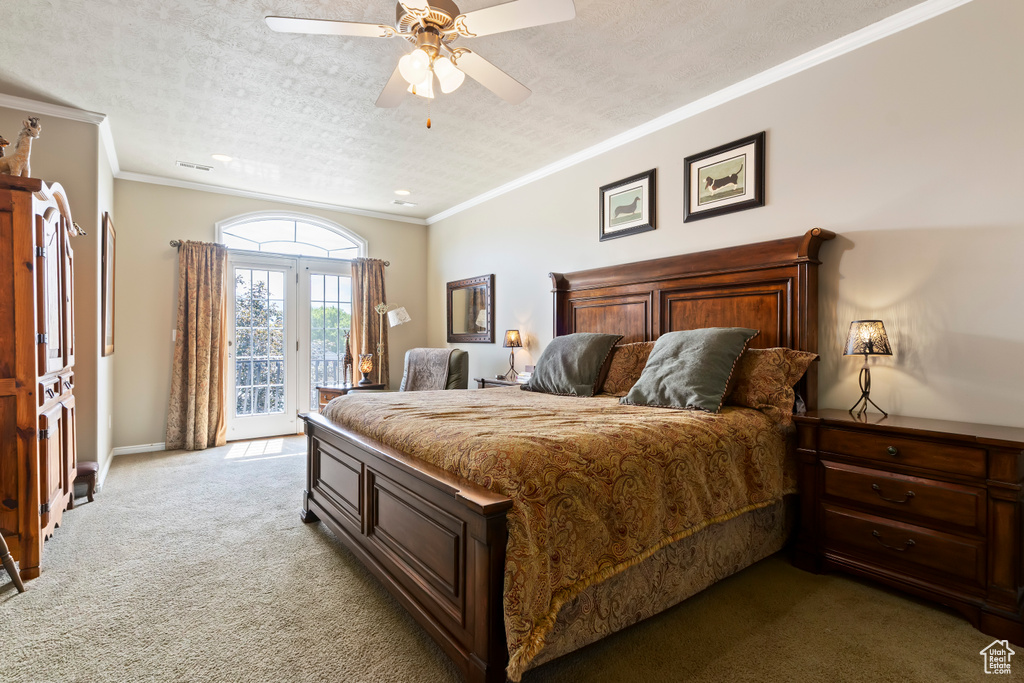 Bedroom with access to outside, light carpet, a ceiling fan, ornamental molding, and a textured ceiling