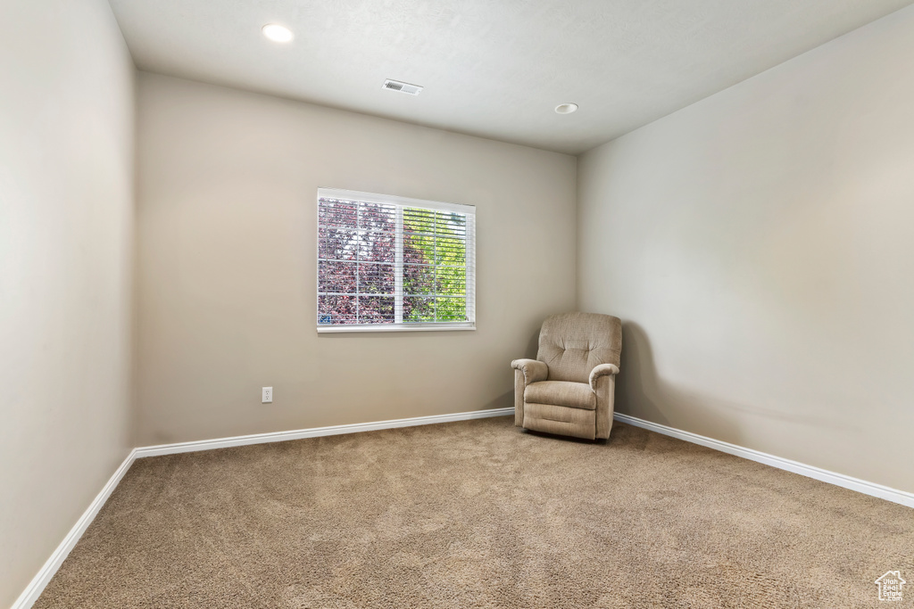 Unfurnished room featuring carpet floors, baseboards, and recessed lighting
