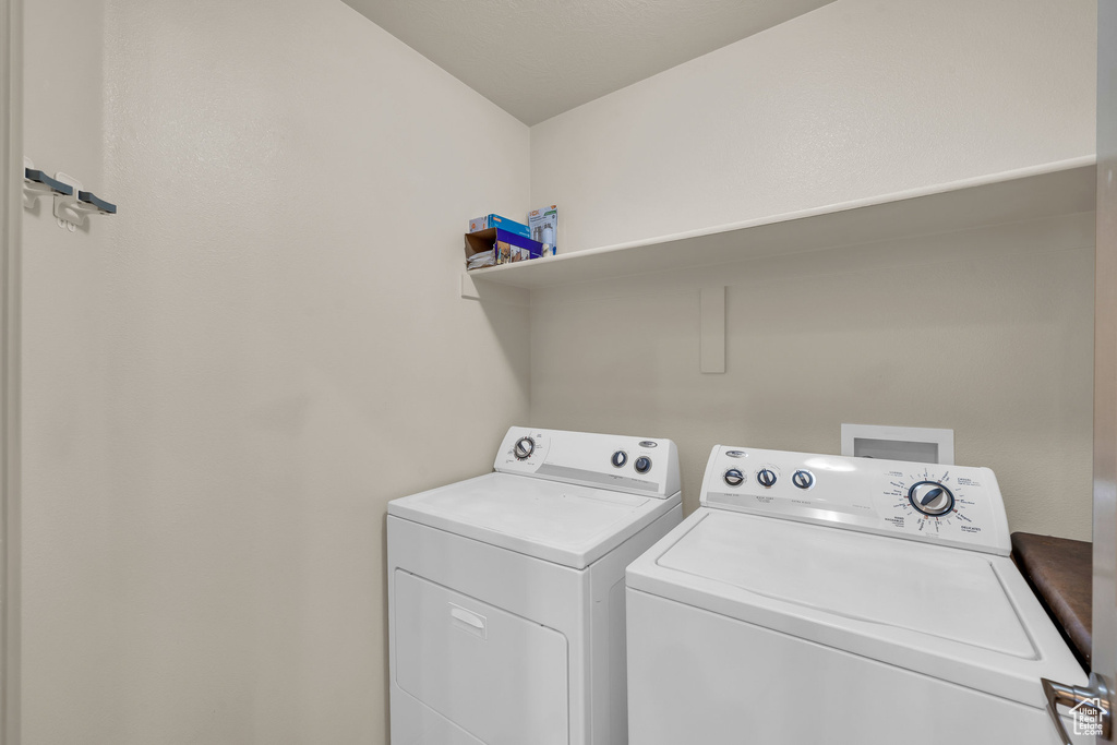 Laundry room featuring washing machine and dryer