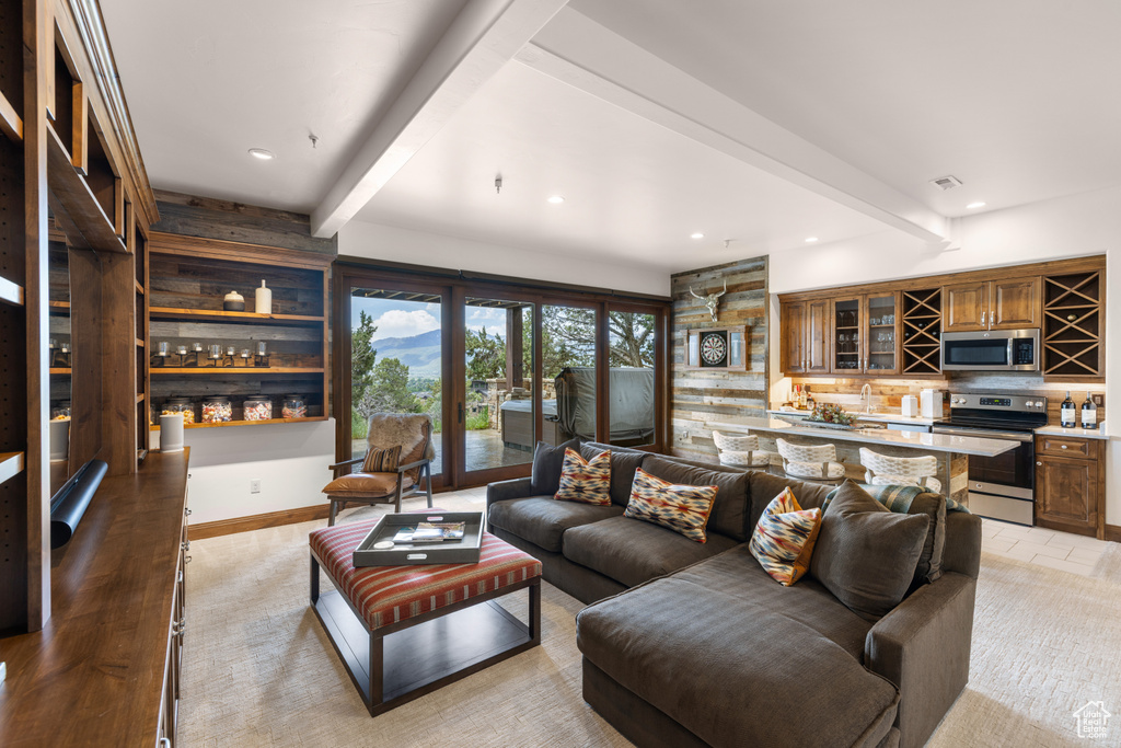 Living room with beam ceiling and recessed lighting