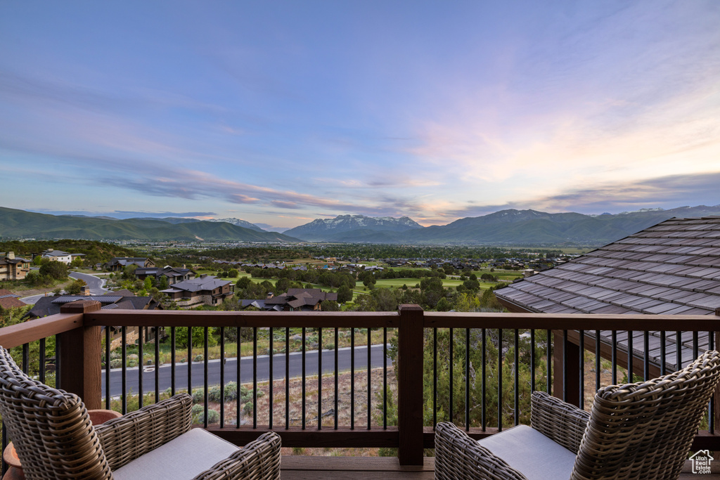 Deck featuring a mountain view and a residential view