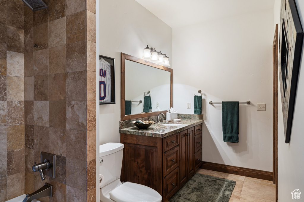 Bathroom featuring vanity, toilet, and shower / bath combination