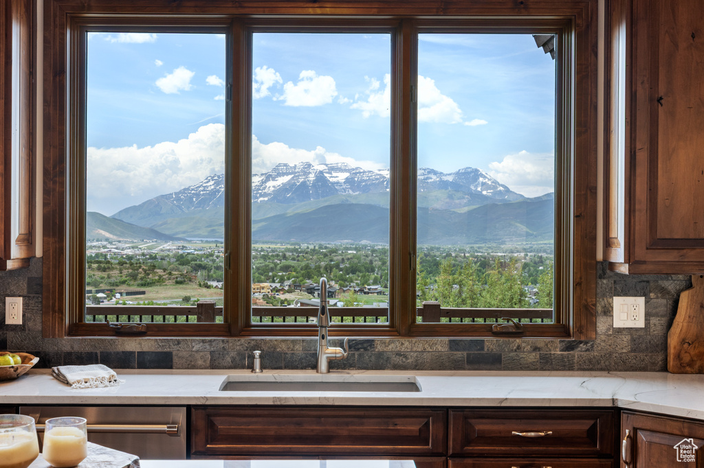 Kitchen featuring a sink, plenty of natural light, and a mountain view