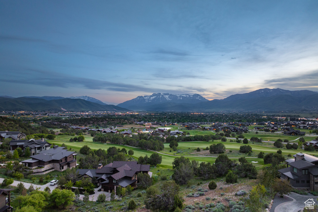 Mountain view featuring nearby suburban area and a golf course