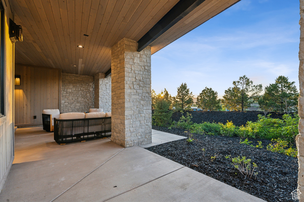 Fenced backyard featuring a patio and an outdoor living space