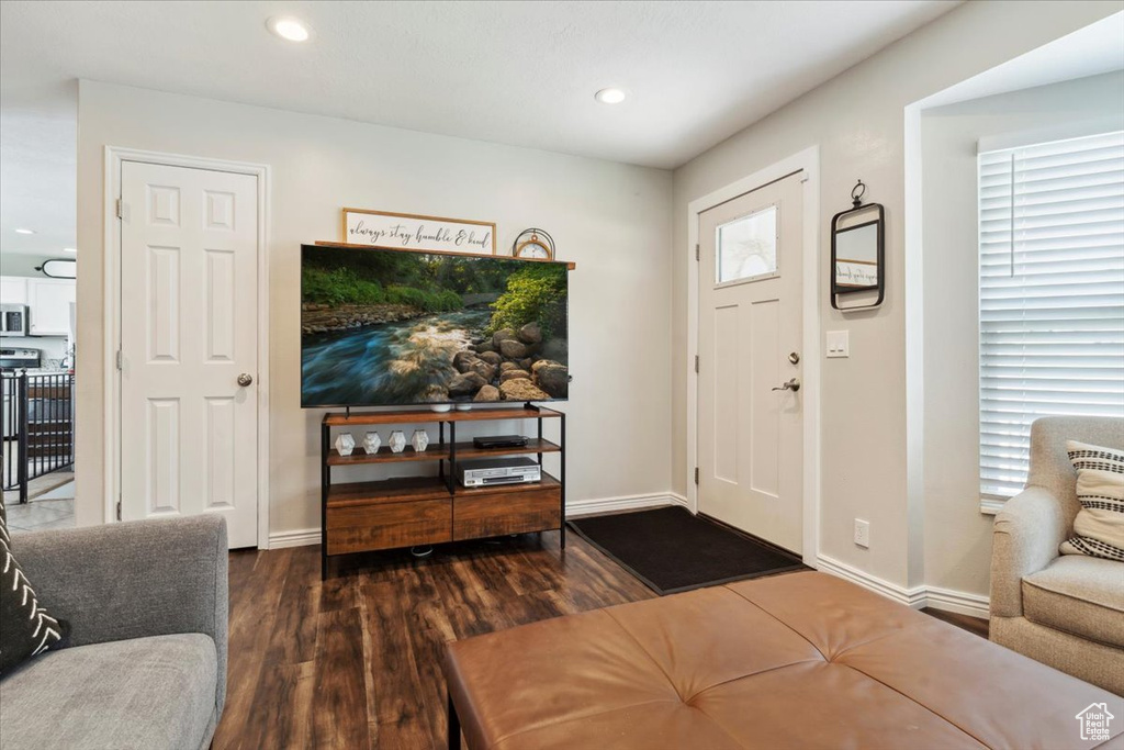 Foyer entrance featuring wood finished floors, recessed lighting, and baseboards