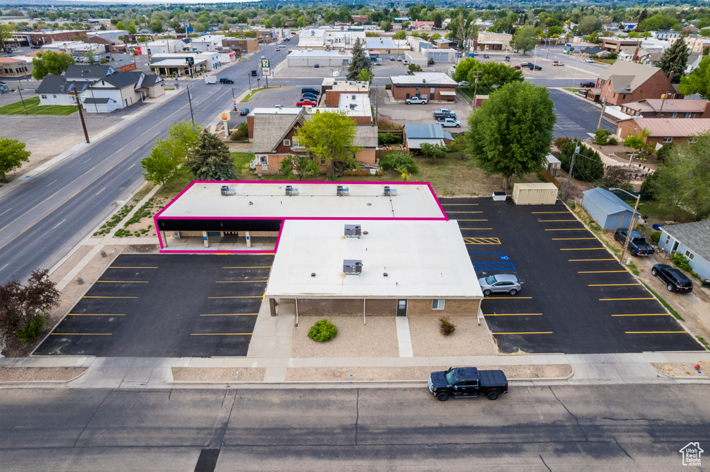 Aerial view of property and surrounding area featuring property parcel outlined