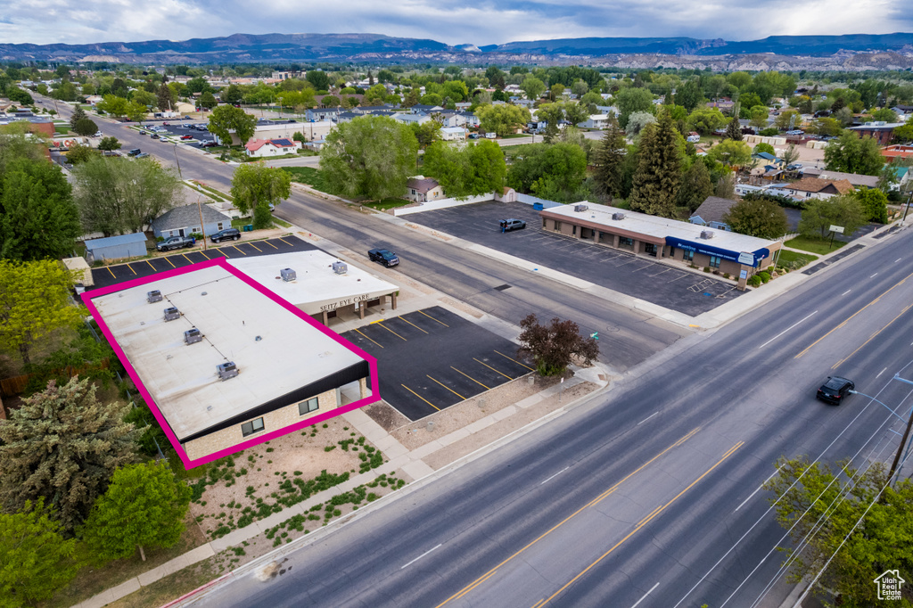 Aerial overview of property\\\\\\\'s location with a mountainous background and property boundaries highlighted