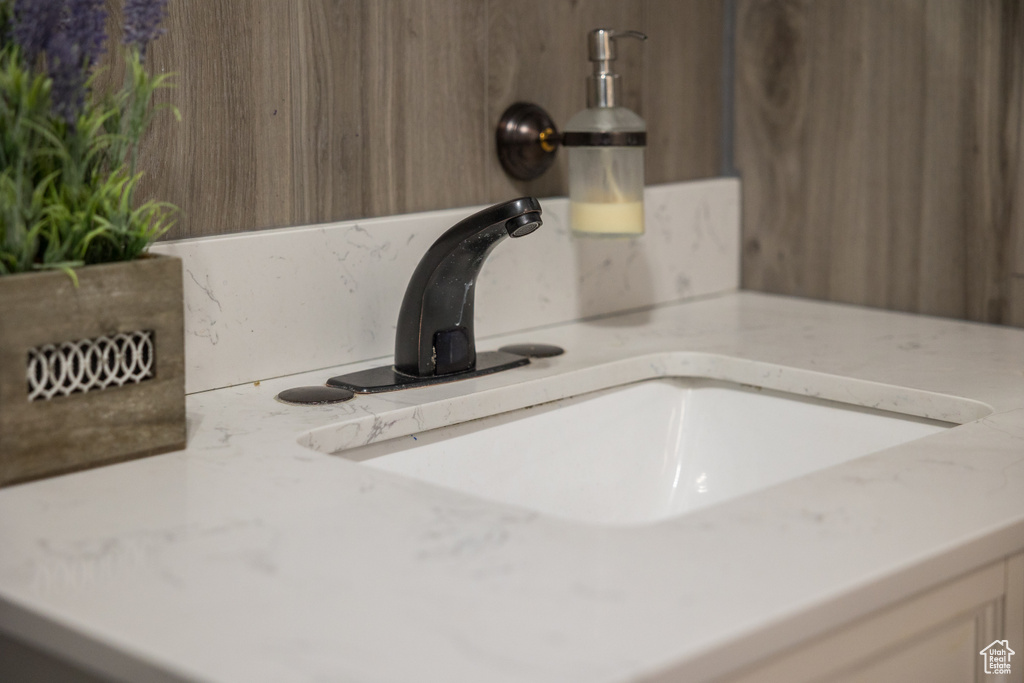 Bathroom view of vanity and tasteful backsplash