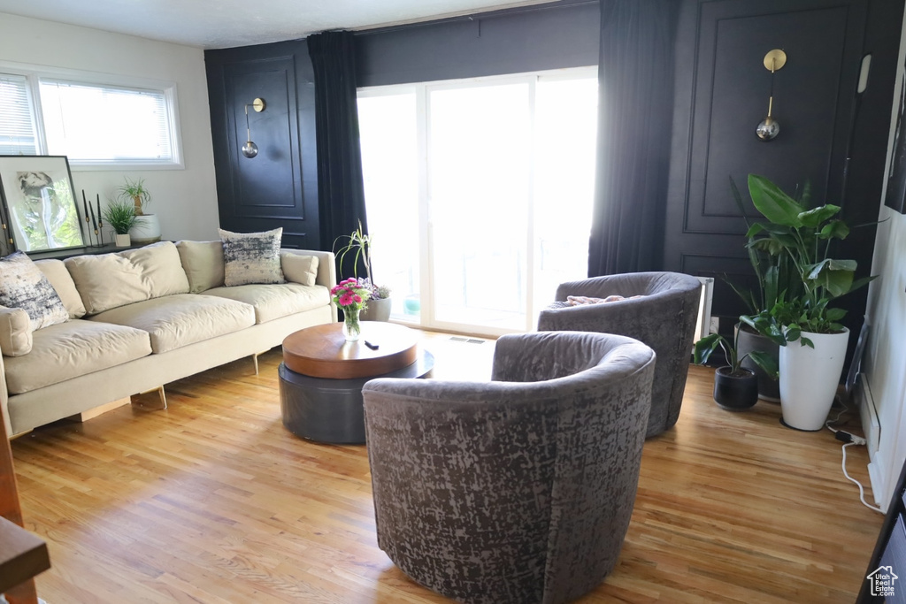 Living area with light wood finished floors