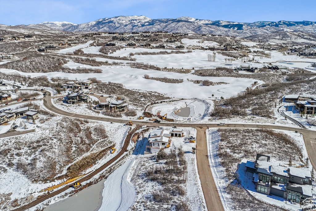 Snowy aerial view with a mountain view